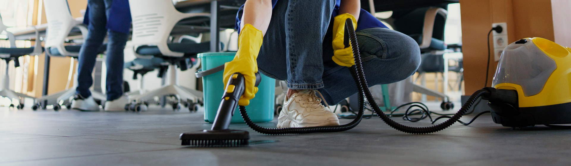 Cleaning professional efficiently using a vacuum cleaner to clean office floor